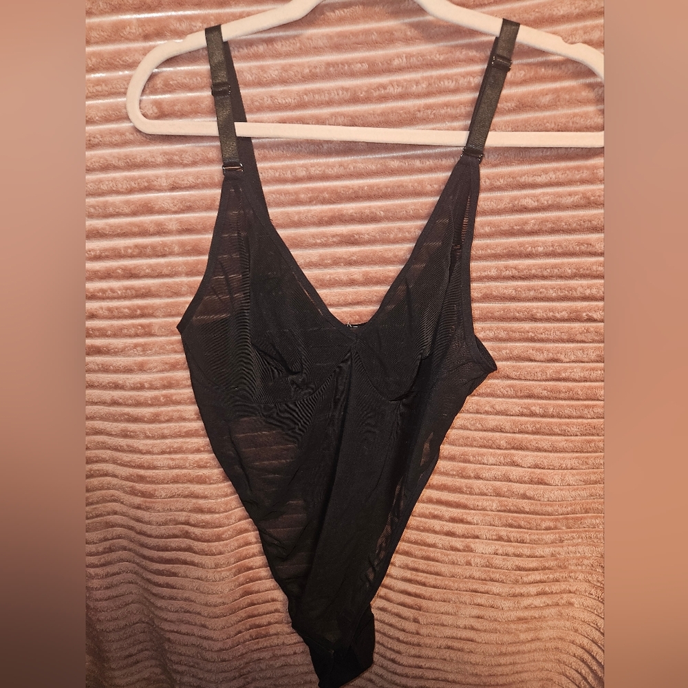 Sheer adjustable compression body suit